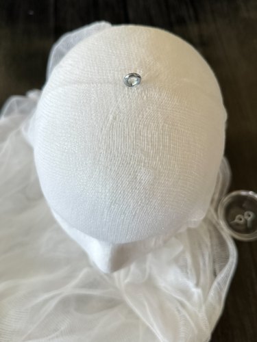 secure eye hook in top of head