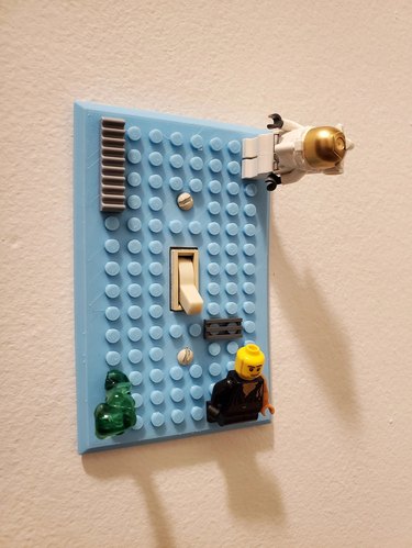 Blue light switch cover made of Lego material