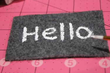Painting hello on the welcome mat