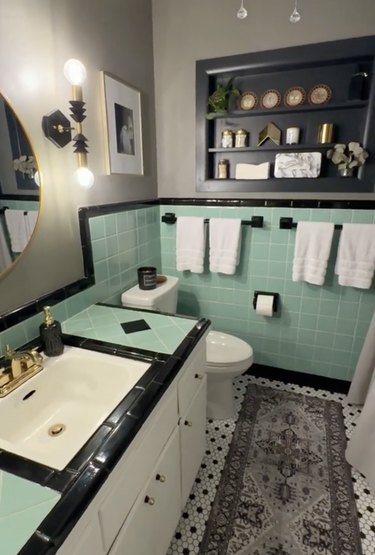 Bathroom with turquoise tile and black accents