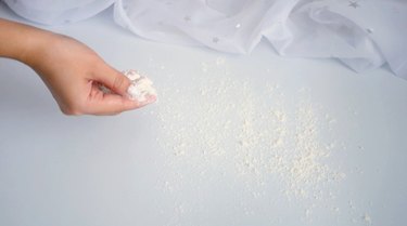 dusting flour on work table