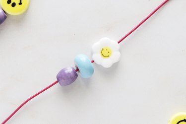 Add ceramic beads to elastic cord