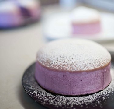 Close-up image of Ube Japanese Cheesecake in all its purple-hued glory, dusted with sugar