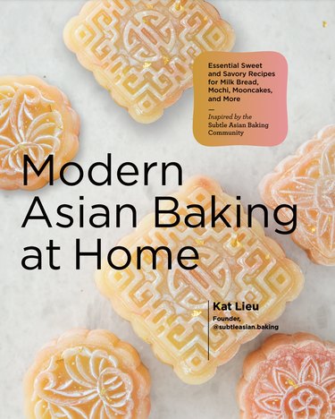 A book cover close-up of Modern Asian Baking at Home showing beautiful pastel-hued pastries
