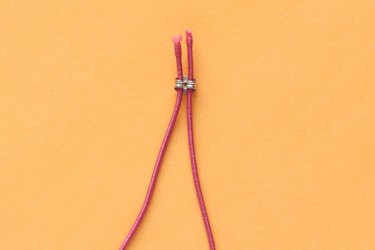 Insert ends of elastic through the earring backing