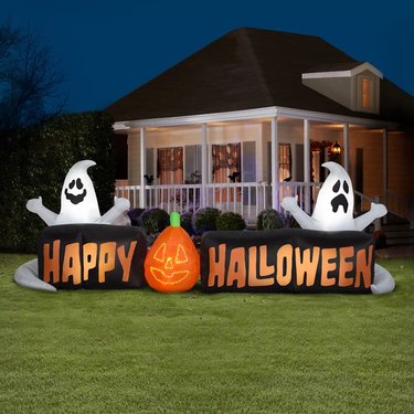 9-foot Happy Halloween yard inflatable sign with pumpkin and ghosts.