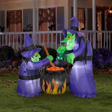 Gemmy Double Bubble Witches Cauldron Halloween Inflatable. Purple and green Halloween inflatable of two witches and cauldron.