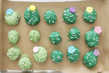Cactus cake balls on parchment paper