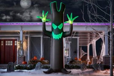 Walmart/Lightshow Airblown®. 12-foot tall black and green spooky tree Halloween inflatable.