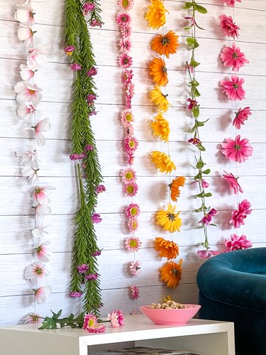 finished floral wall hanging vertical on light wood wall