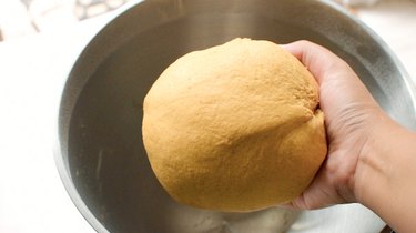Smooth ball of pumpkin bread dough
