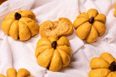 Dinner rolls shaped like orange pumpkins