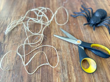 12-foot piece of twine with scissors and a decorative spider