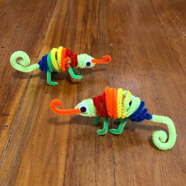 Rainbow-colored chameleons made from pipe cleaners