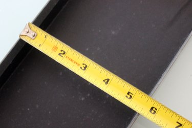 measuring the width of a shoe box lid
