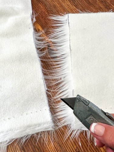 measure and cut faux fur with utility knife