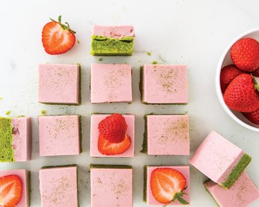 Delightful pastel pink and green Berry Matcha Cream Bars all lined up in a beautiful row