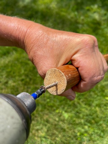 drill screws into ends of wooden poles