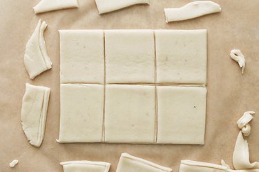Cutting sugar cookie dough into rectangles