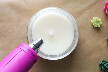 Melting top of candle with a heat gun