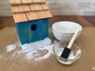 add sand to bird house