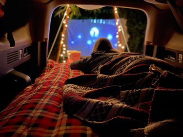 watching outdoor movie from inside car trunk