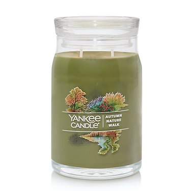 Yankee Candle Autumn Nature Walk candle against a white background. The candle is a mid-tone green color and has two wicks.