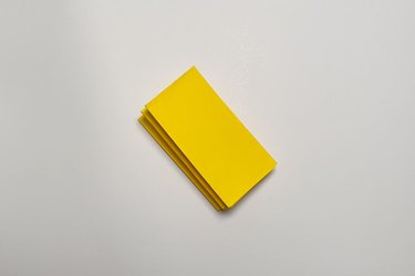 A piece of yellow paper folded into a small rectangle