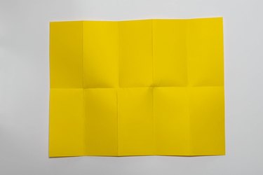 A piece of yellow paper folded to have 10 equal-size rectangles