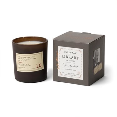 Library John Steinbeck Candle from Paddywax with a brown glass vessel and a decorative box with the author's face on it.