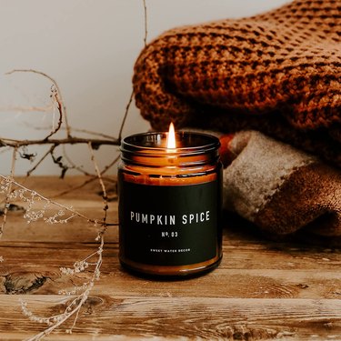 Pumpkin Spice Candle from Amazon in a dark brown jar with a black label with white lettering that says "Pumpkin Spice."