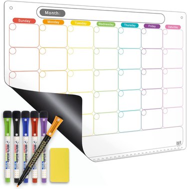 Colorful wall calendar with dry-erase markers and an eraser.