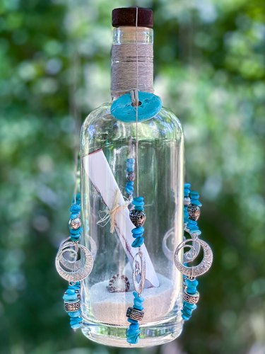 vertical shot of message in a bottle wind chimes