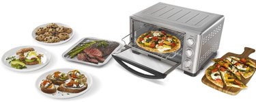 Cuisinart toaster oven/broiler, depicted on a white ground surrounded by baked and broiled foods, from pizza to steak
