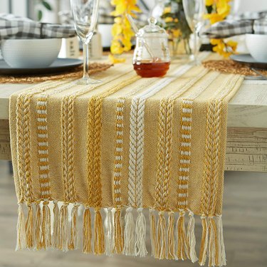 Honey and gold braided table runner on a set farmhouse table