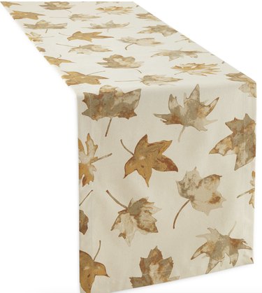 Off-white table runner with autumn leaves