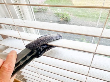 cleaning window blinds