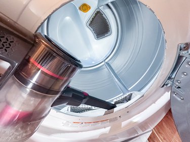 cleaning under the lint trap in a dryer