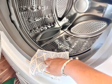 cleaning the rubber pieces on a washing machine