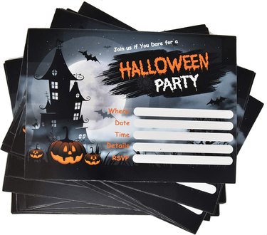 Halloween party invitation with haunted house and pumpkins