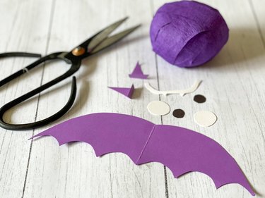 Cut out paper shapes for decorating Halloween surprise ball