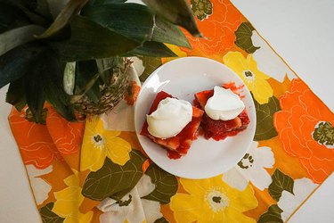Strawberry Jell-O squared topped with large dollops of Cool Whip