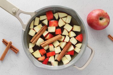 Combine the water, apple cider, apples, cinnamon sticks, brown sugar and vanilla in a pan