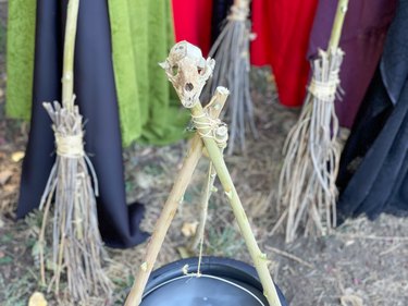 skull tripod for a cauldron
