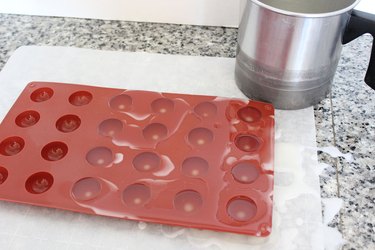 pouring wax into mold