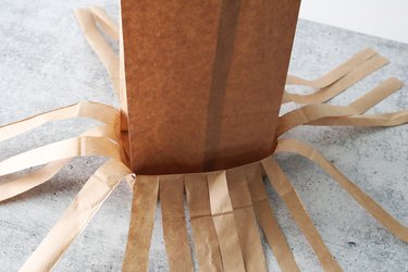 Brown paper bags for witch's broom Halloween treat bags
