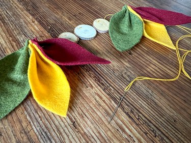 threaded leaves and wooden discs