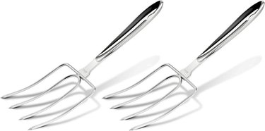 A pair of shiny, elegant-looking stainless steel four-pronged turkey forks