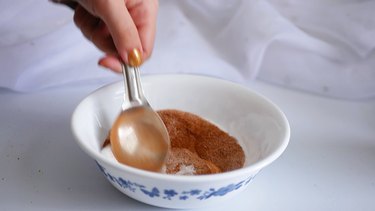 mixing the cinnamon sugar