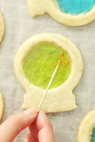 Add gel or icing to the sugar cookies